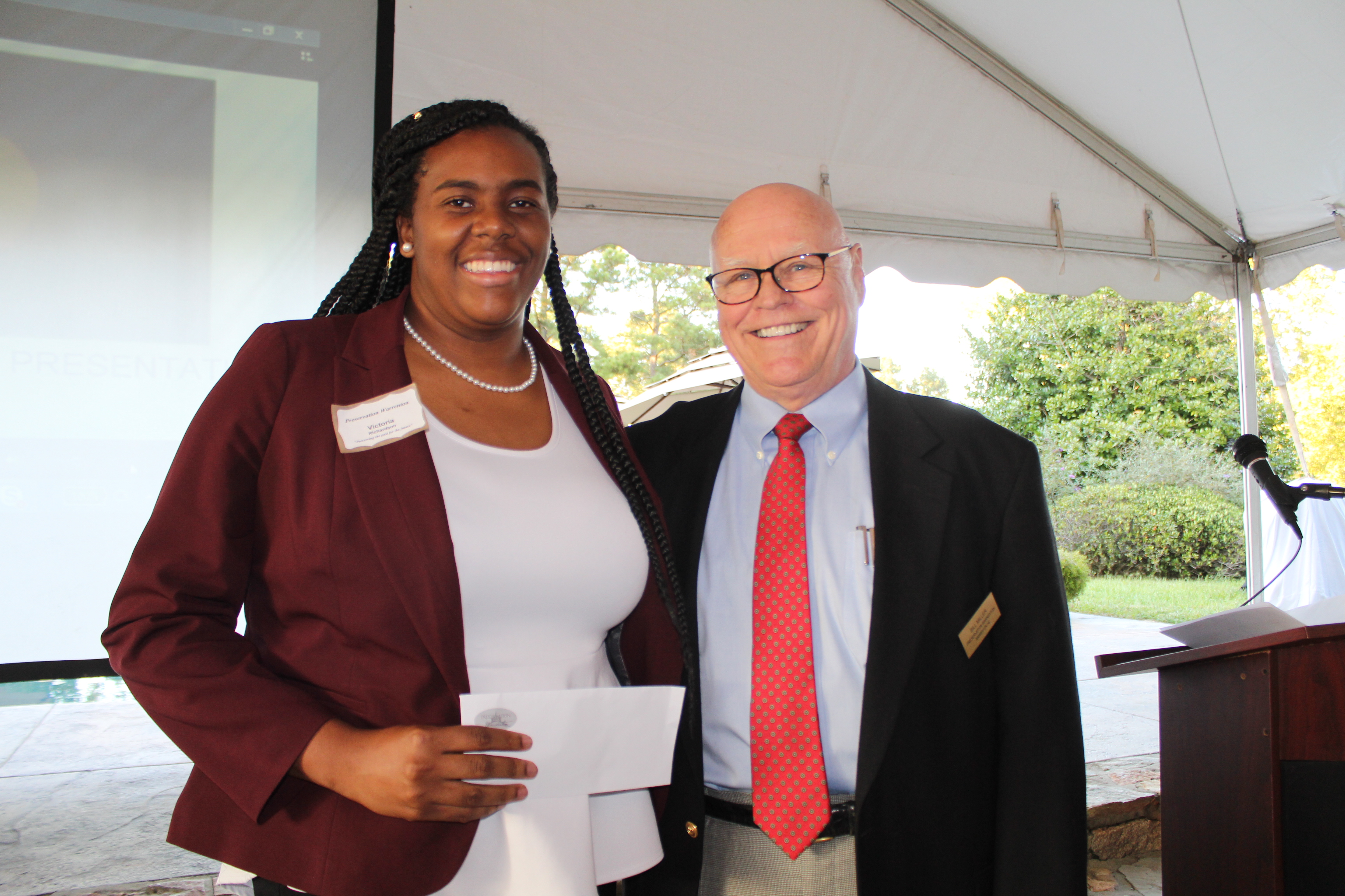 Preservation Warrenton President Bill Miller, right, presents the organizations annual scholarship to Warren County High School 2017 graduate Victoria Richardson.

